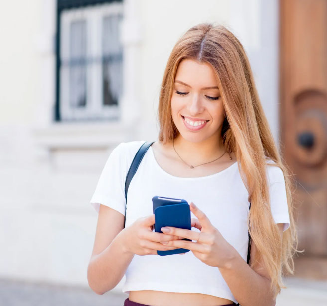 Girl smiling on her phone